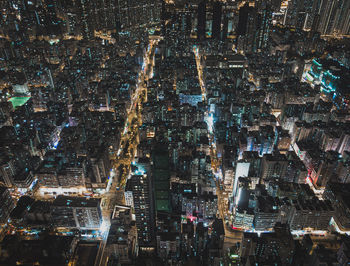 High angle view of city lit up at night