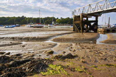 Boats moored on sea against sky