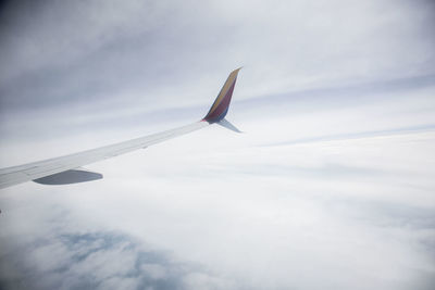 Close-up of airplane flying in sky