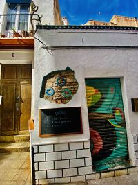 Low angle view of graffiti on building wall