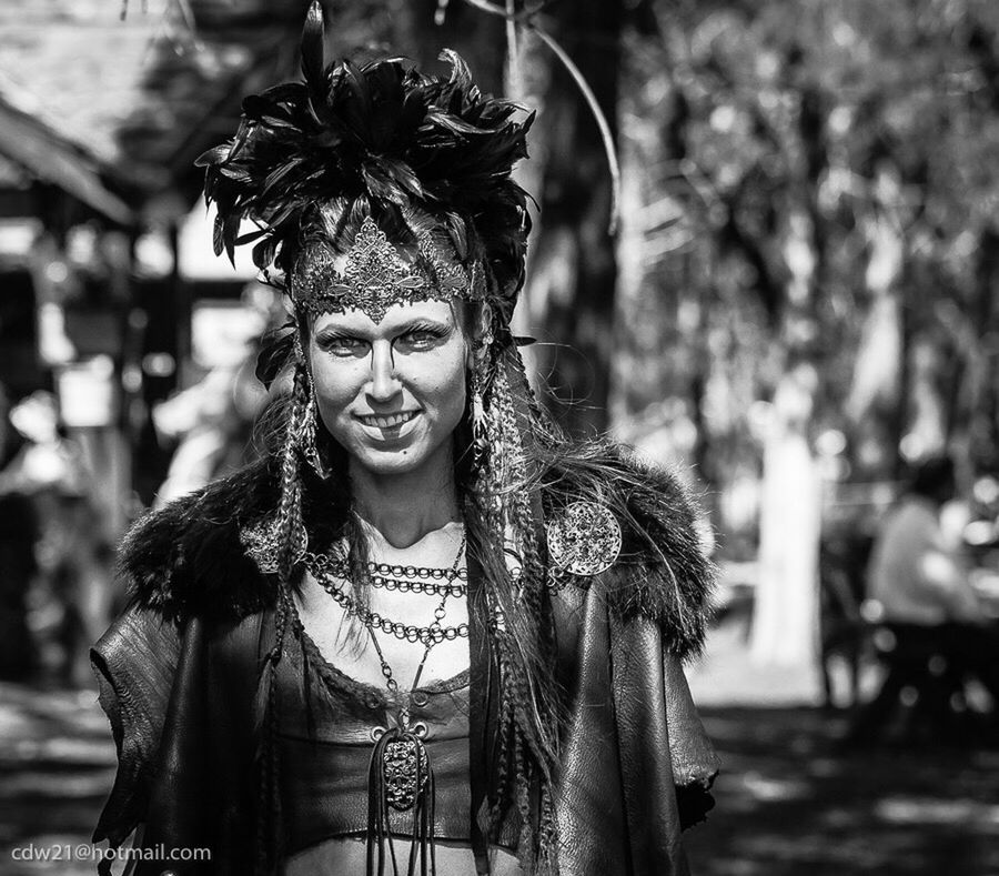 focus on foreground, person, looking at camera, portrait, lifestyles, front view, young adult, smiling, leisure activity, casual clothing, tree, happiness, standing, young women, waist up, outdoors, toothy smile, headshot