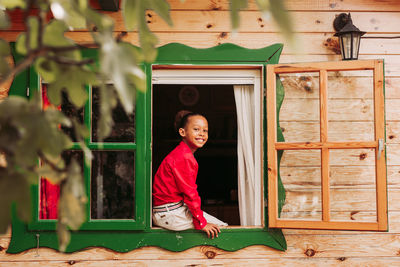 Portrait of smiling girl standing outdoors