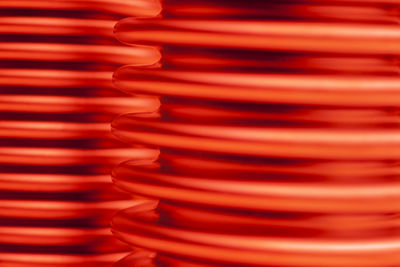 Glowing hot corrugated pipes of steel for heating or cooling - selective focus