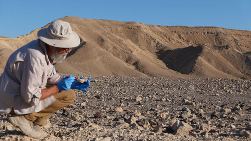 Archaeologist at work in the desert 