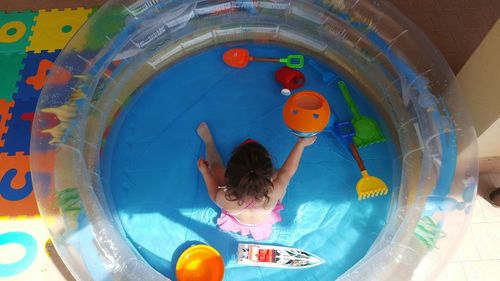 Boy playing in swimming pool