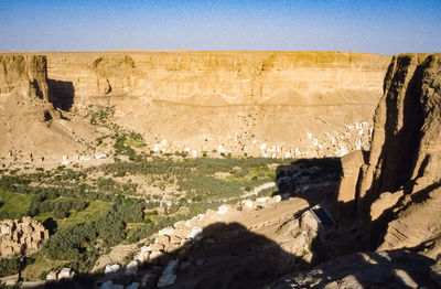 Rock formations on landscape against sky