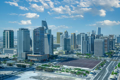 Modern designed towers constructed at lusail city with clear blue cloudy sky