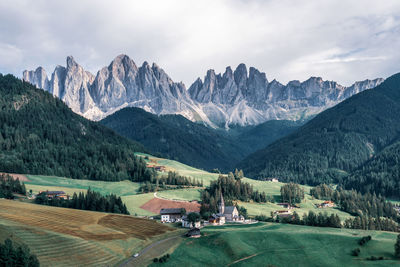 The odle mountain peaks and the church of santa maddalena. sankt maddalena, val di funes in italy.