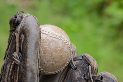 Close-up of old glove and ball