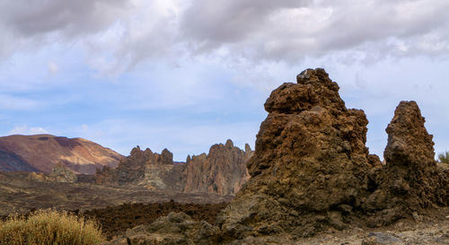 Panoramic view of rock formations against sky