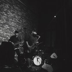 People playing piano at night