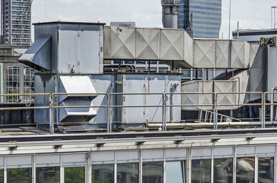 Front view of ducts and other ventialtion machinery on the roof of an office building