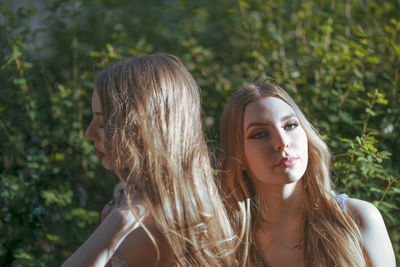 Beautiful friends standing in park