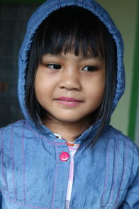 Cute smiling girl wearing hood