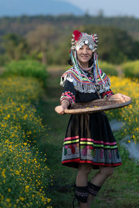 Full length of a girl standing on field