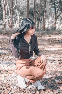 Woman sitting in a forest