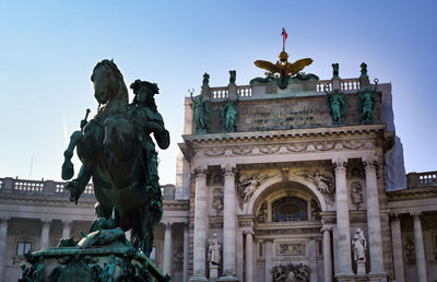 Low angle view of statue against sky