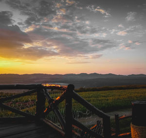 Scenic view of field against sky during sunset