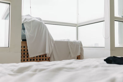 White curtain on bed at home