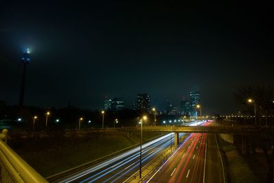 High angle view of light trails on road at night