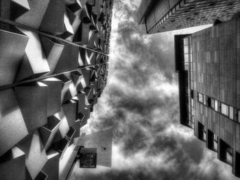 Low angle view of building against cloudy sky