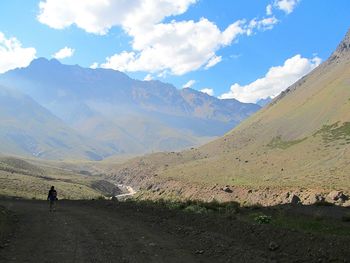 Scenic view of mountains against cloudy sky