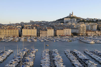 Boats moored at harbor