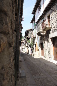 Narrow alley amidst buildings in city