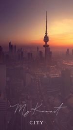 Aerial view of buildings in city during sunset