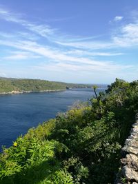 Scenic view of sea against blue sky