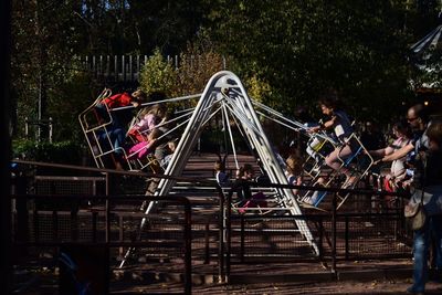 People at amusement park ride