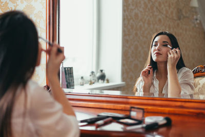 Young woman using mobile phone