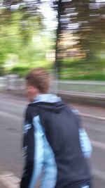 Blurred motion of people on road