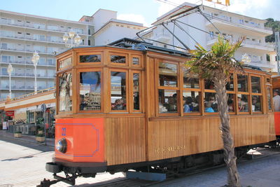 Train on railroad track in city