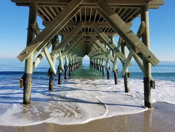 Pier over sea against sky