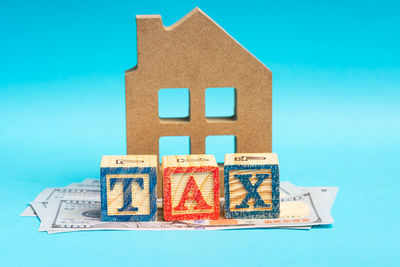 Close-up of information sign against blue background