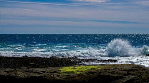 Waves splashing on rocks at shore