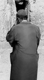 Rear view of young woman standing