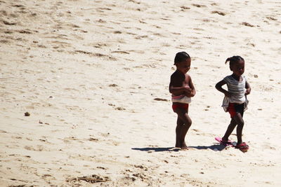 Full length of boys on beach