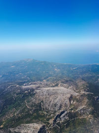 High angle view of landscape against blue sky