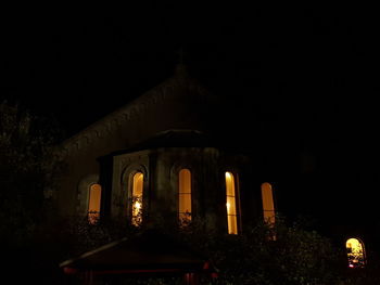 Low angle view of illuminated building at night