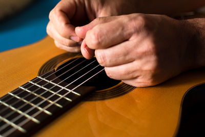 Hands on top of a classical guitar. quality music