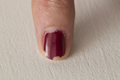 Cropped finger with nail polish