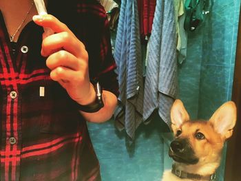 Close-up of woman holding dog