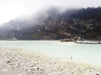 Scenic view of lake by mountains