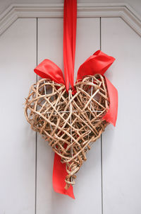 High angle view of heart shape decoration on table against wall