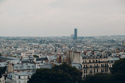 High angle view of buildings in city against sky