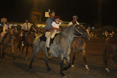 Two men on horse cart