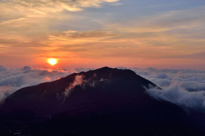 Scenic view of mountains against sky during sunset