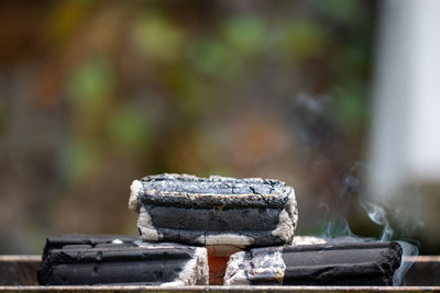 Close-up of charcoal stack burning